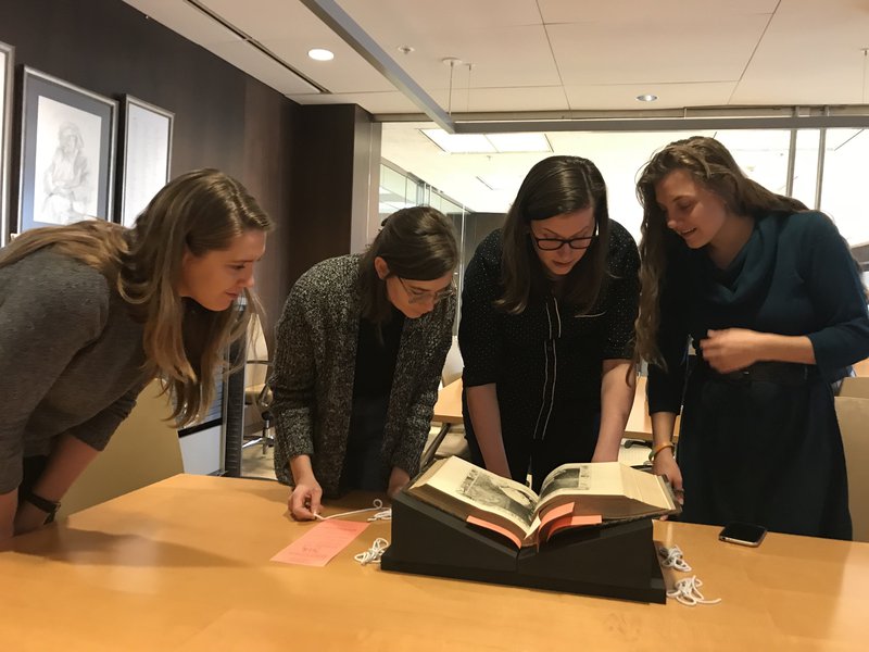 students examining archived materials