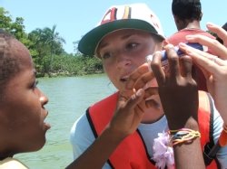 Alaina Mallette shows student how to use the water test kits on the Yasica River in the Dominican Republic