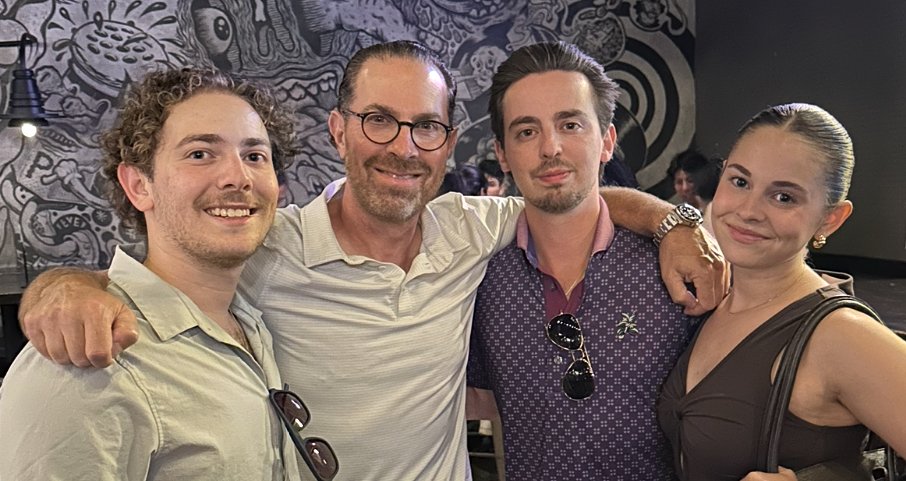 Four people posing for a photo.