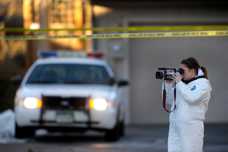 Person photographing a crime scene.