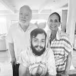 Black and white photo of three people.