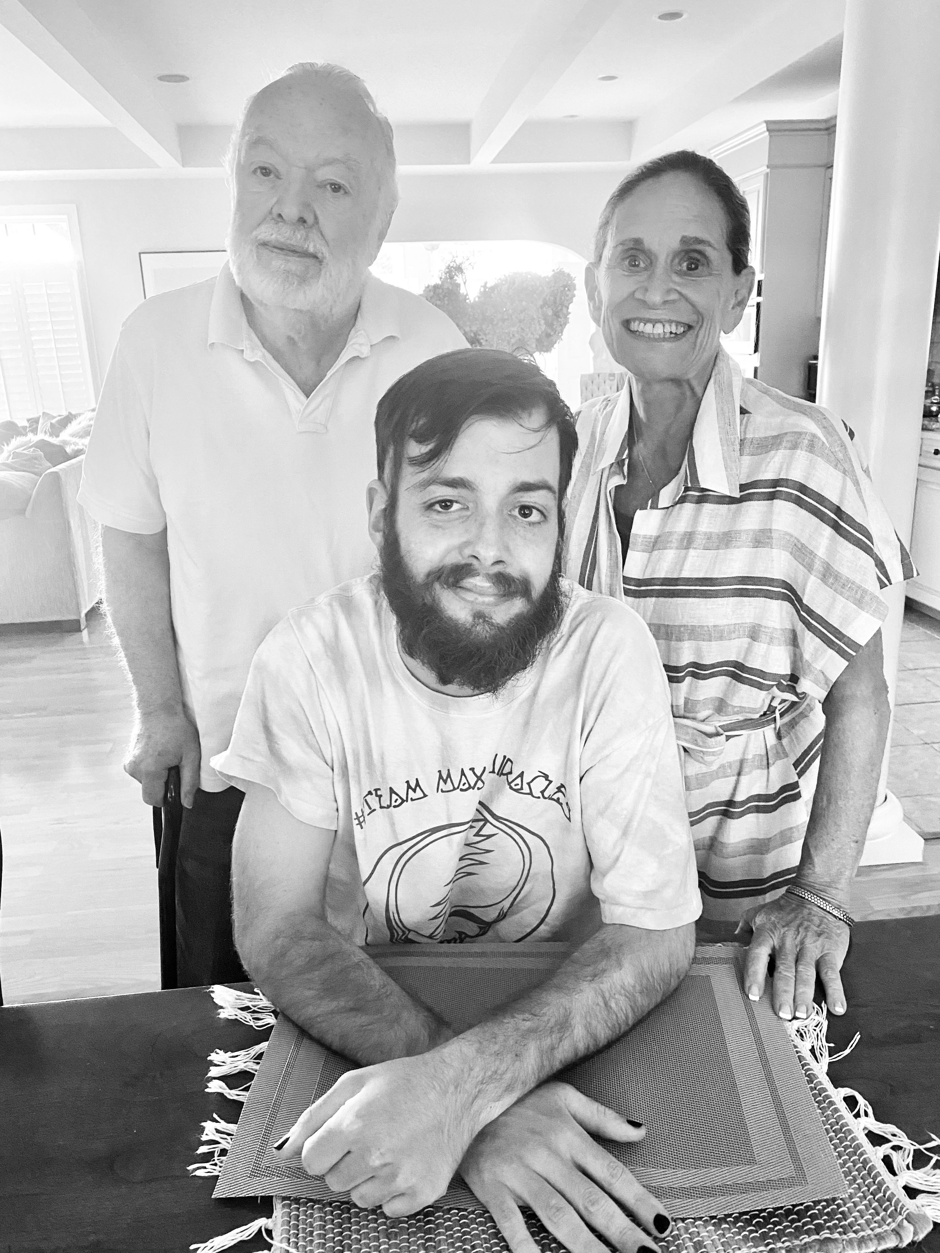 Black and white photo of three people.