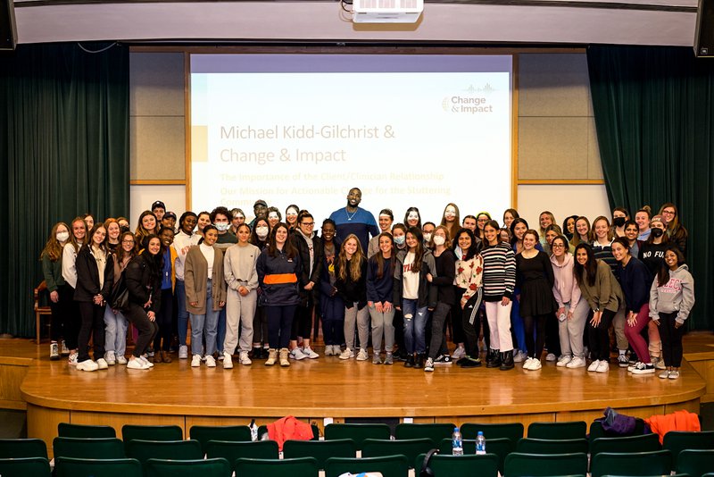 Michael Kidd-Gilchrist with students.