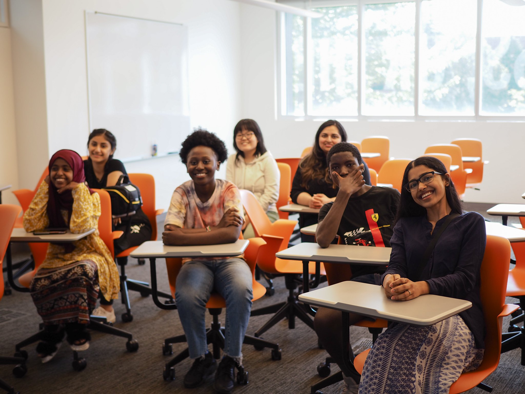 Students engaged in EHN programming at classroom in Newhouse School