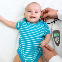 Baby having hearing screening.
