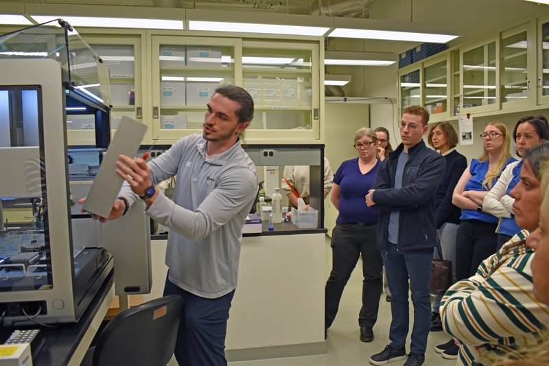 Person giving a demonstration of a sequencing workstation.