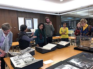 Four people looking at Special Collections items