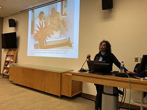 Prof. Sumathi Ramaswamy (Duke University) in front of a projector