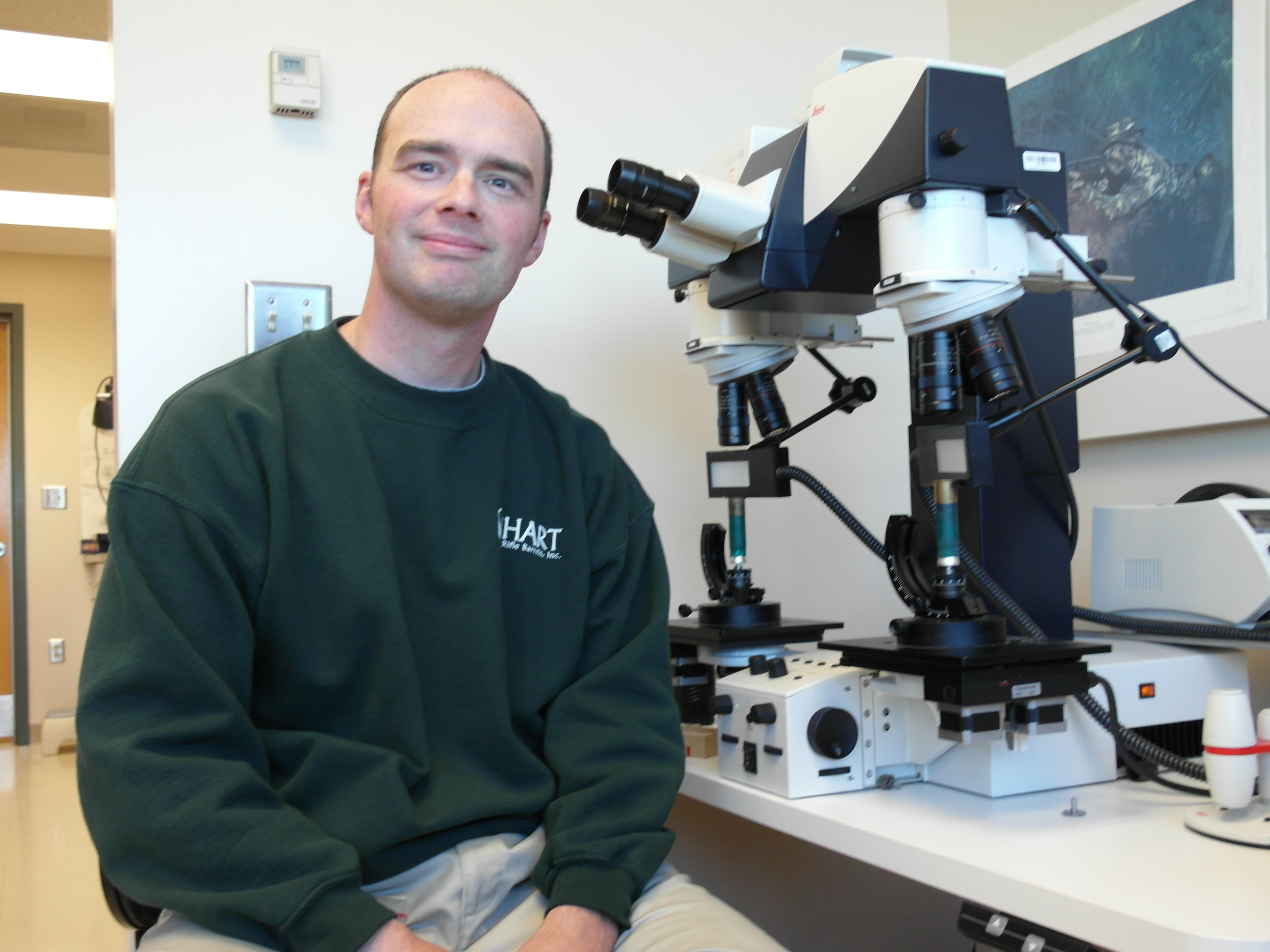 Matt Kurimsky with microscope