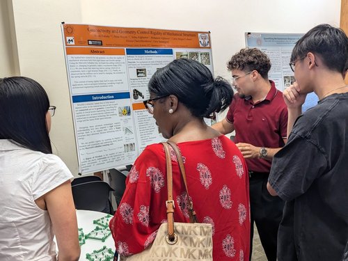 Person giving a poster presentation.