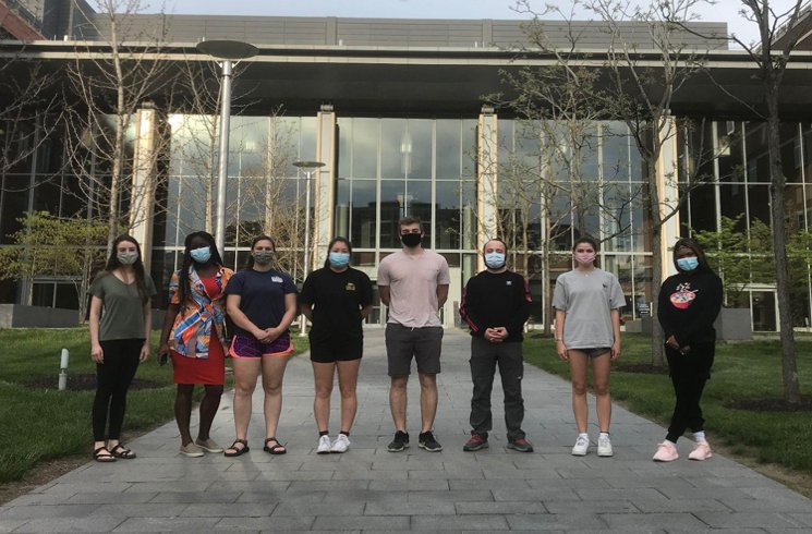 Science Outreach in biology student standing in a line.