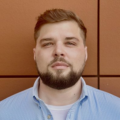 portrait of a brown haired bearded man