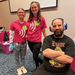 Three people posing for a photo.