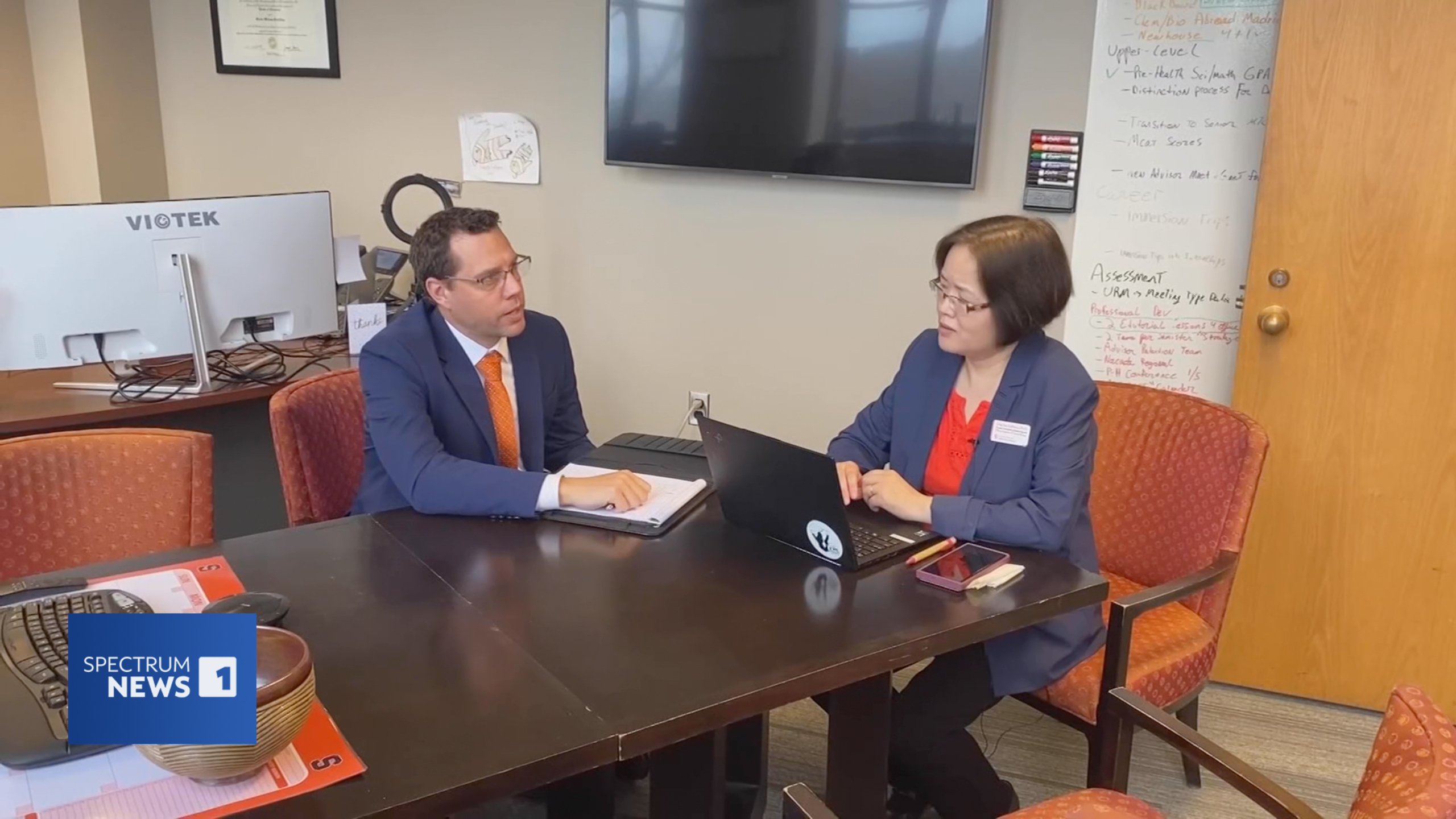 Two people sitting at a table.