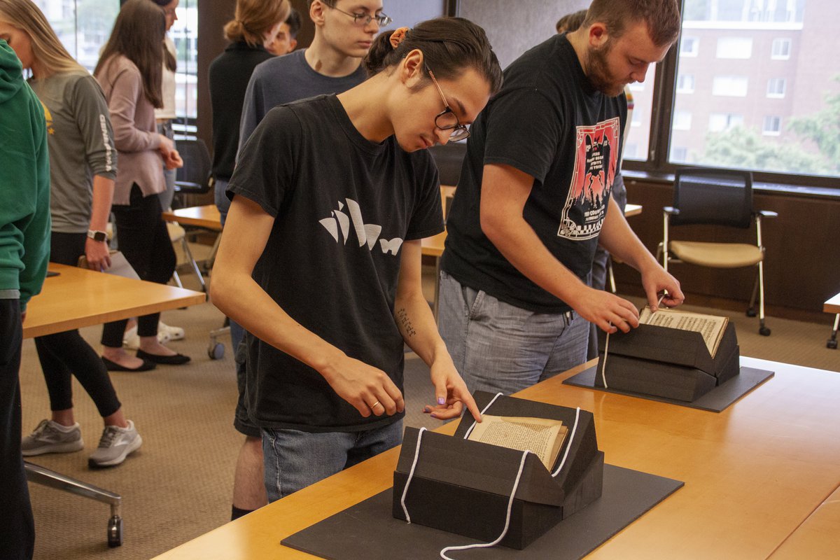 Students from Amanda Eubanks Winkler’s European Music Before 1800 class take a closer look at books from the research center’s medieval and early modern musical collections.