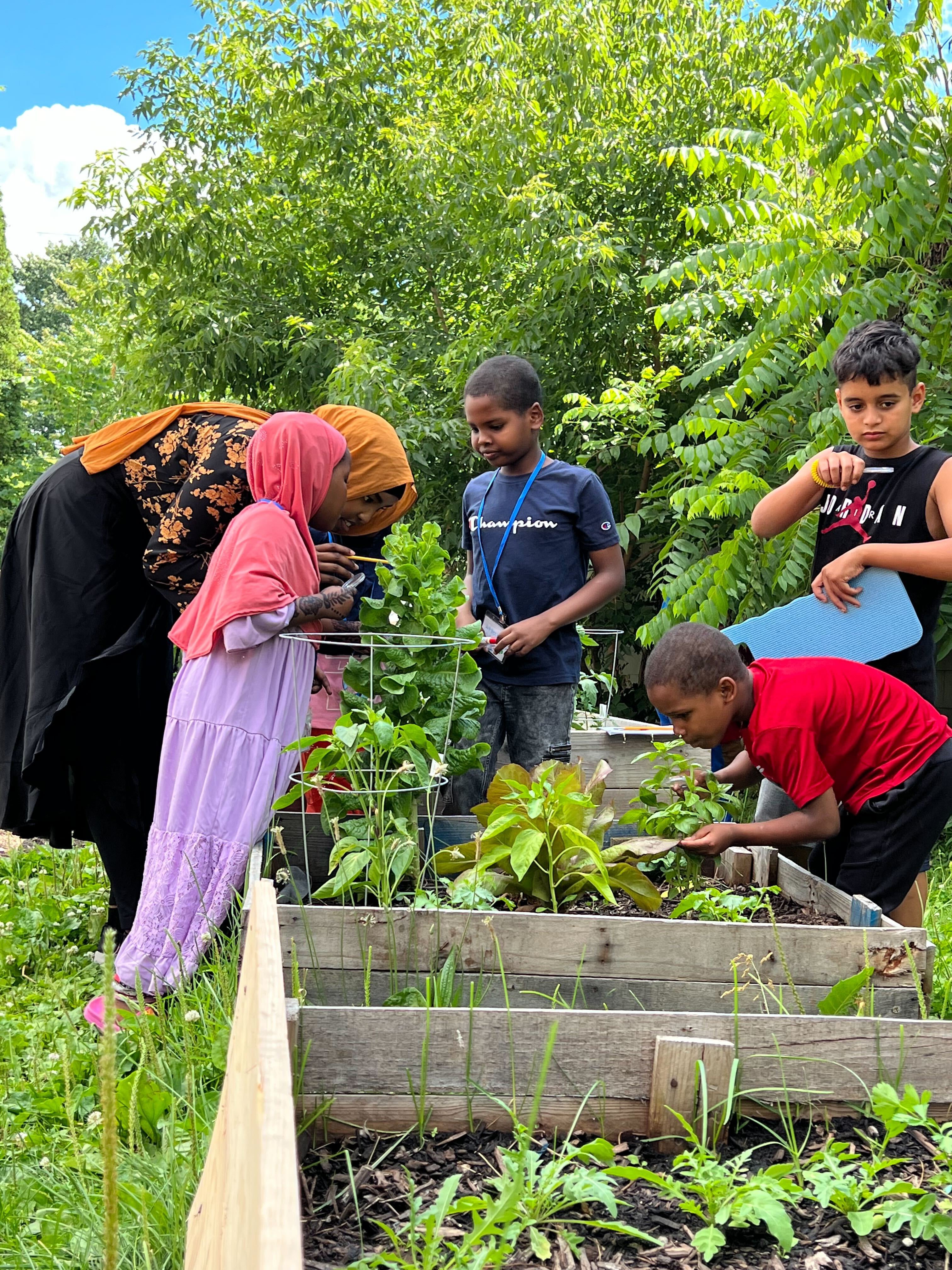 North Side Learning Center Students Working in Garden