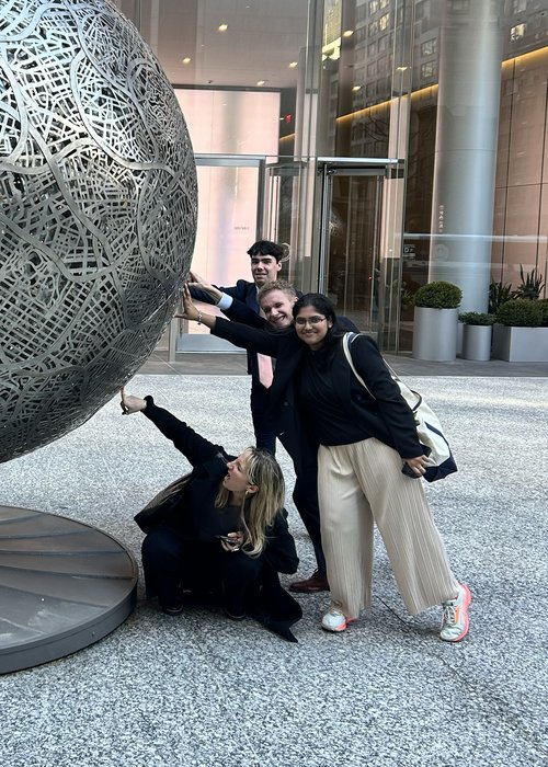 Students with Ball Statue NYC Immersion 2025
