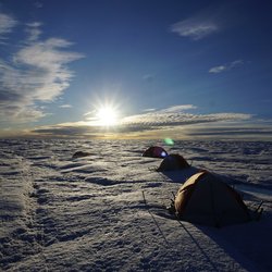 Base camps set up on an ice sheet.