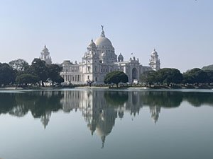 The Taj Mahal in the background with water in the foreground