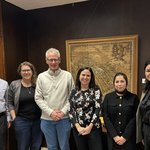 Group of people standing in a line.