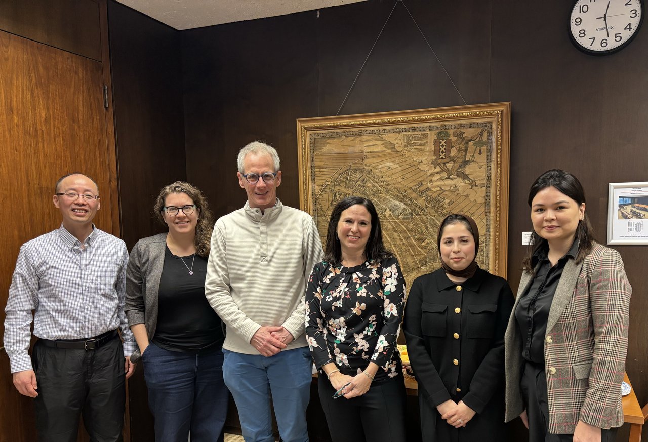 Group of people standing in a line.