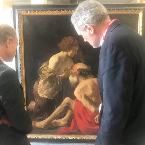 Wayne Franits viewing  the painting Roman Charity.