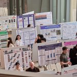 An aerial view of the undergraduate research festival featuring students presenting research posters.