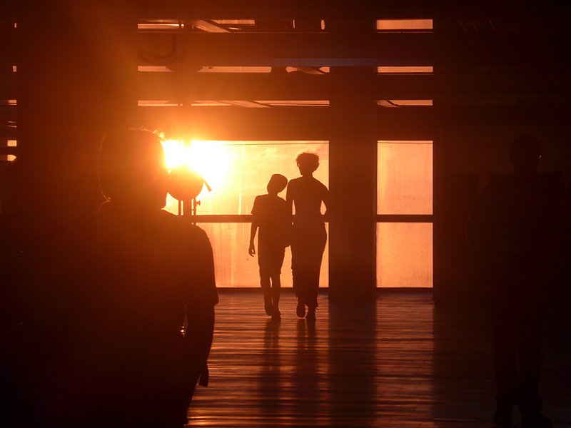 two people walking through an airport