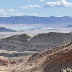 Valley with water and mountains in the background.