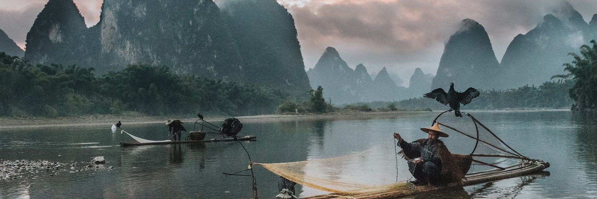 Sunset on the Li River as the few remaining cormorant fisherman pack