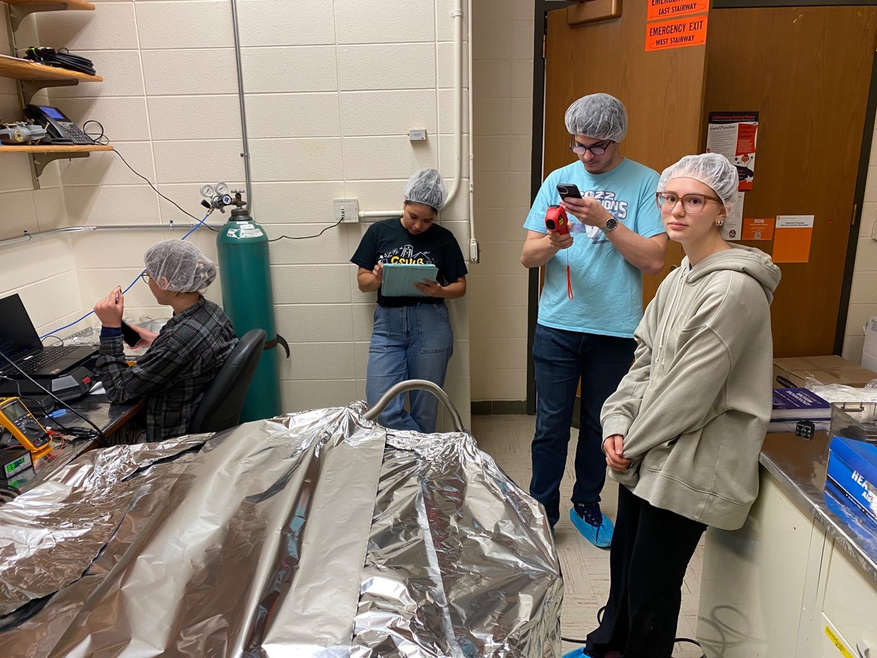 Physics students during vacuum tank bakeout