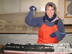 Zunli Lu's research associate, Professor Rosalind Rickaby of Oxford University, digs out ikaite crystals from a sediment core obtained off the coast of Antarctica. The sediment cores and the crystals must be stored in a freezer or the crystals will melt. 