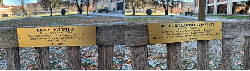 brass memorial placards on wooden benches