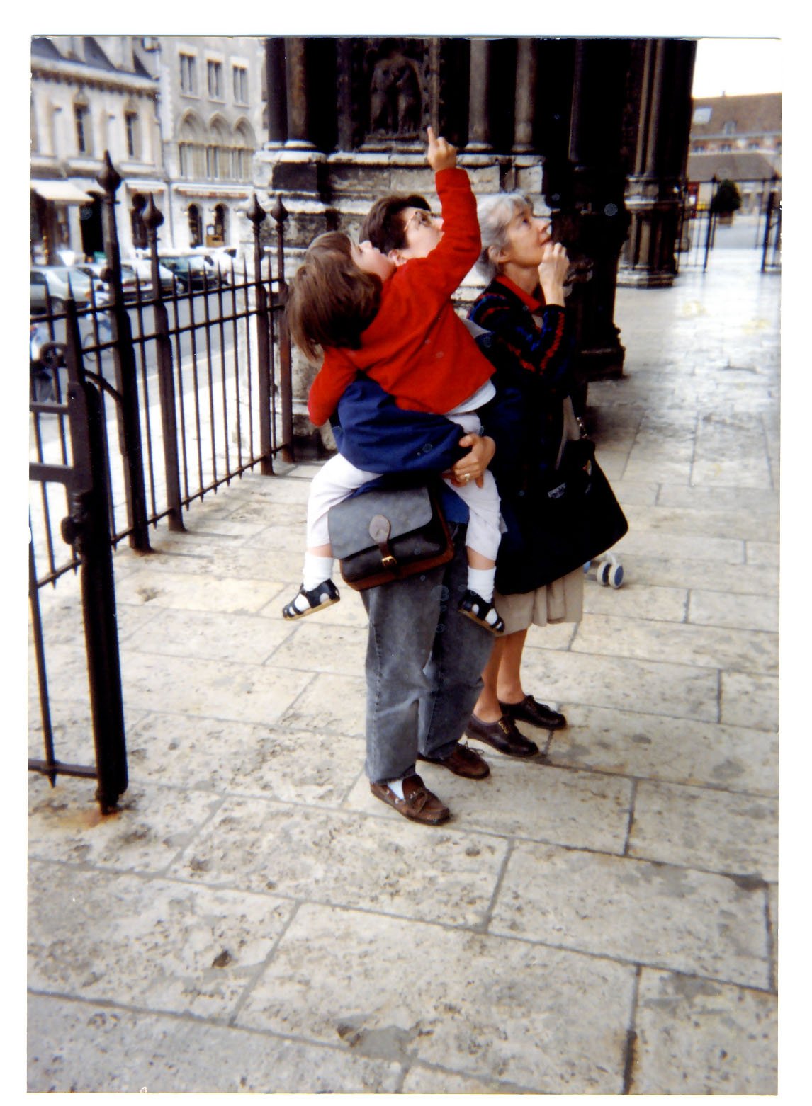 Two women and a child looking up.