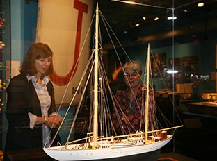 Newton and Deborah Douglas admire a model of the R/V Atlantis at the MIT Museum.  