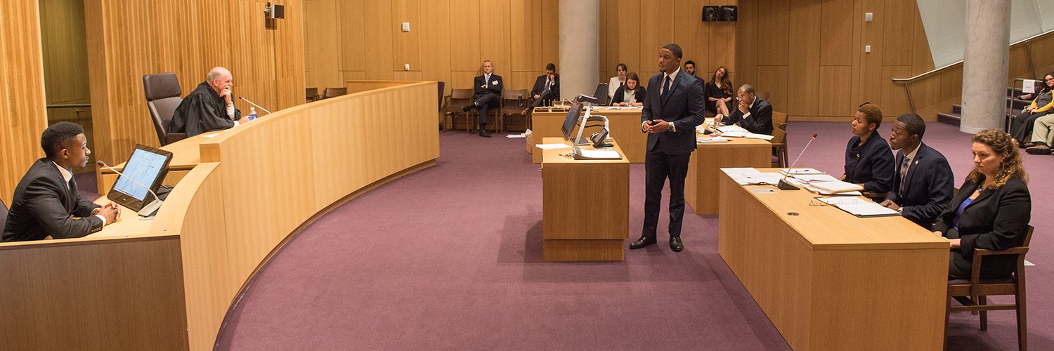 mock courtroom with witness, judge, and attorney's.