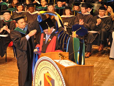 SUNY officials bestow an honorary doctor of science degree on Gorovitz at Upstate Medical University's 2016 Commencement (Photo by Heidi Gorovitz Robertson)