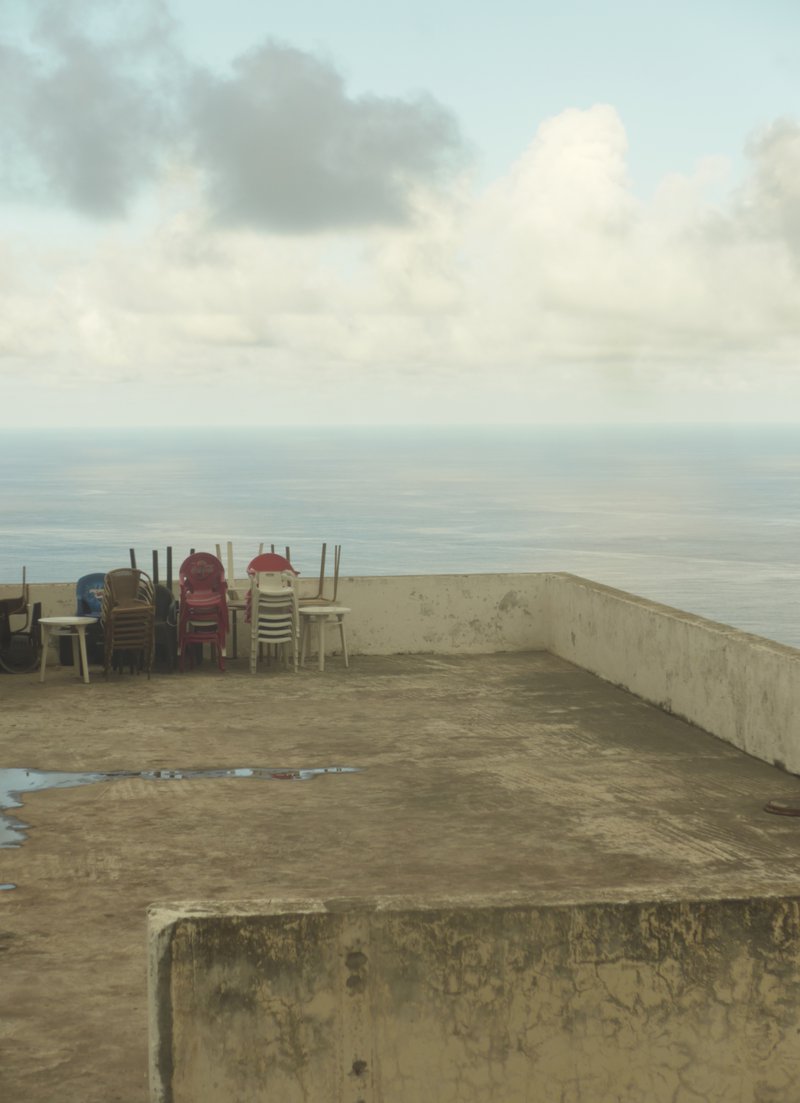 stacked chairs on a rooftop