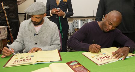 With illustrator Shane Evans '93 during a book signing in Syracuse