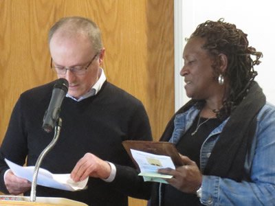 Professor Stefano Giannini presents the 2018 Sanford Award to custodian Erma Martin. 