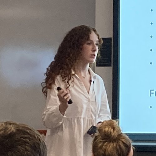 Suzanne Enos presenting the team’s research at an REU session.